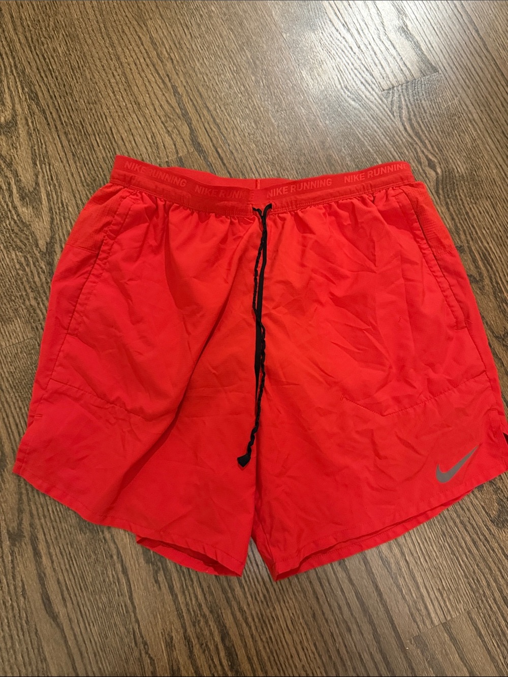 Nike Red Athletic Shorts with Black Drawcord and Silver Swoosh
